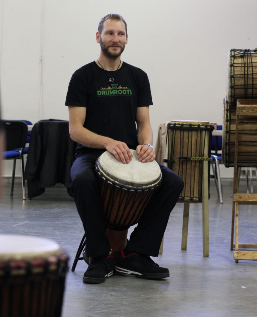 Jamie from Drumroots facilitating an African drumming workshop for St james catholic high school 
