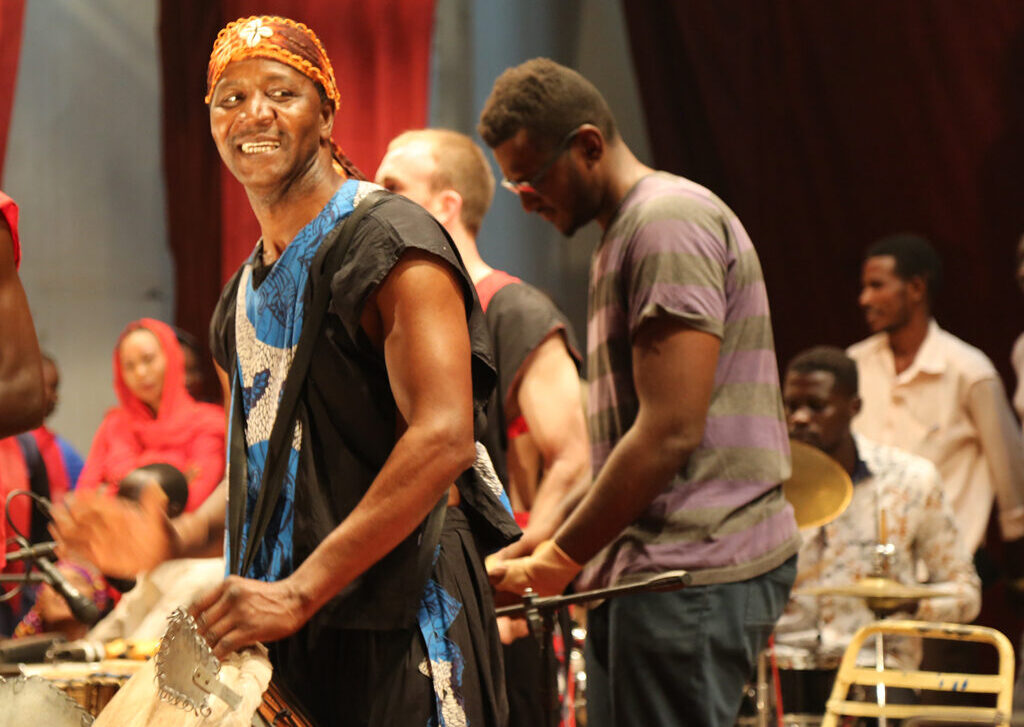 Drumroots with master drummer Iya Sako performing in Sudan