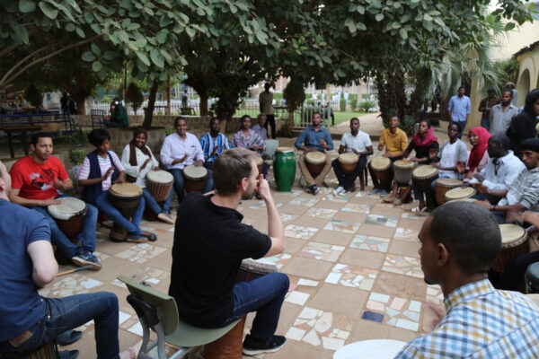 Drumroots running a drumming workshop in Sudan