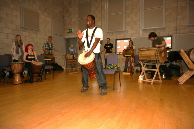 Master drummer Iya Sako teaching a djembe workshop for Drumroots
