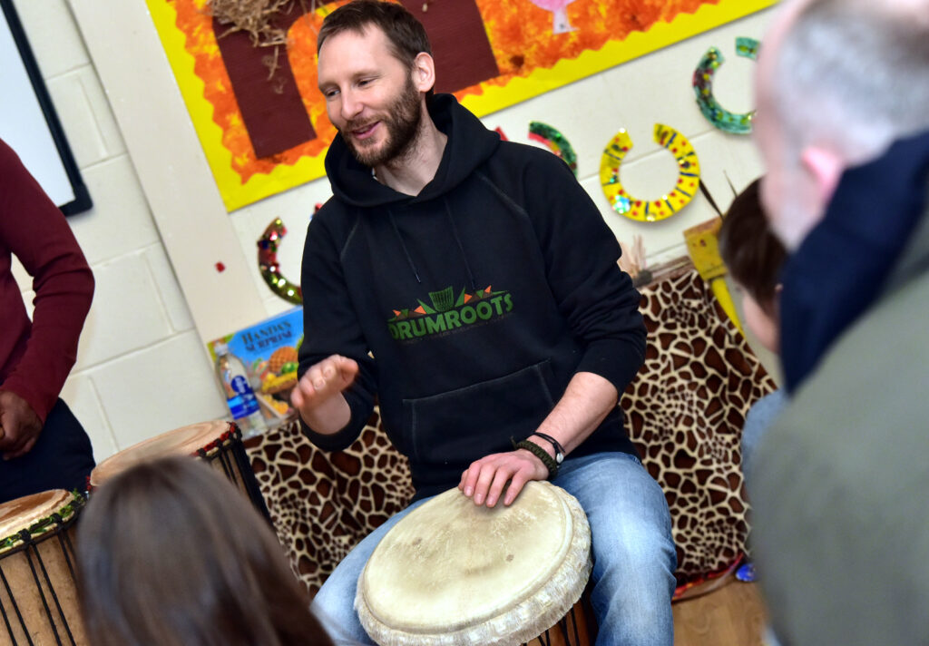 Members of Drumroots take a drumming workshop at Eatock primary school, Westhoughton