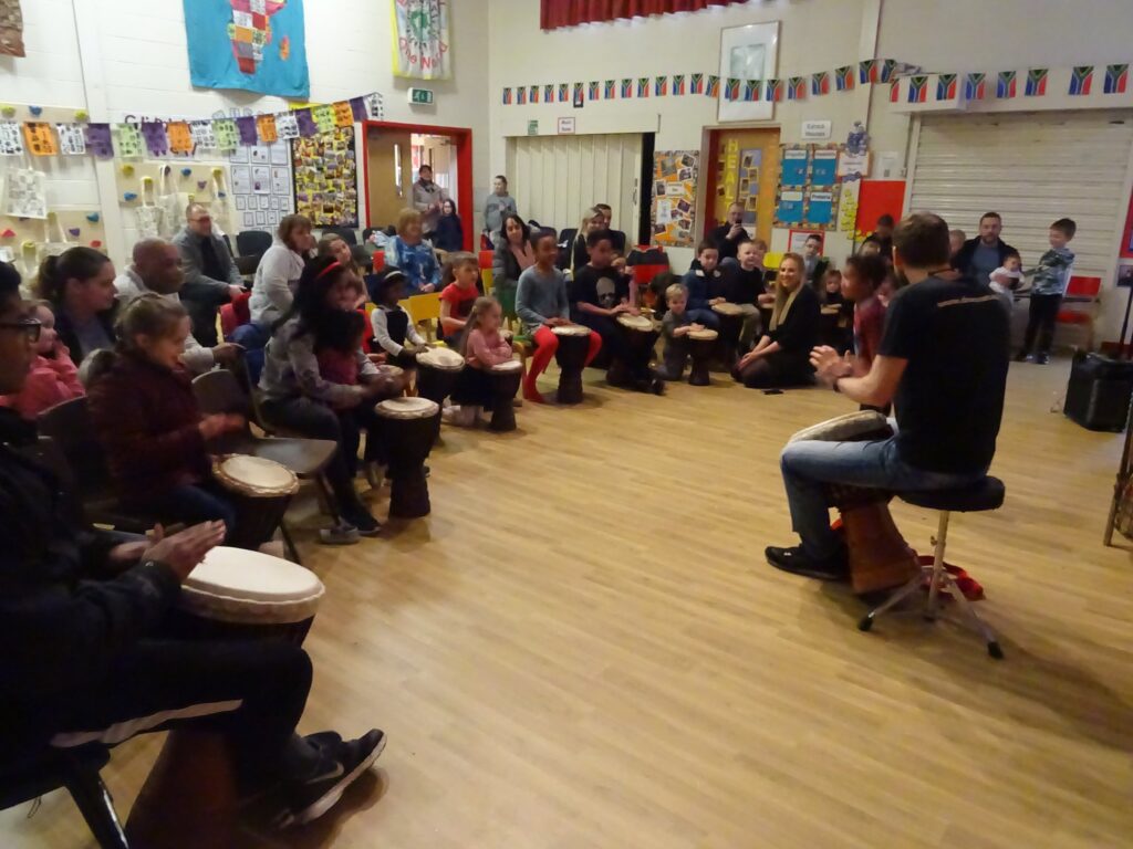 Members of Drumroots take a drumming workshop at Eatock primary school, Westhoughton