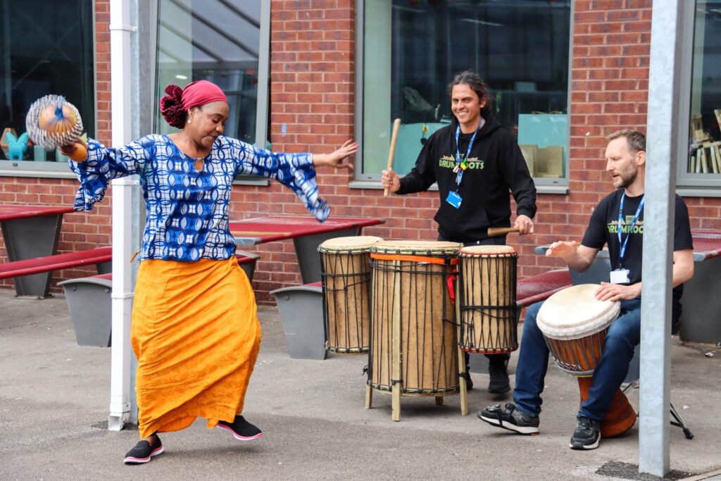 Jokeh Sillah leading a West African dance workshop in Manchester with Drumroots