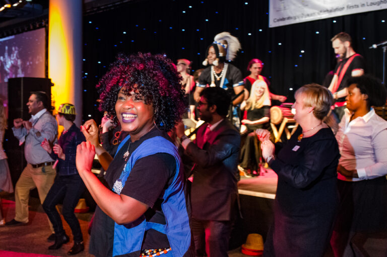 Jokeh Sillah performing traditional Gambian dance with Tanante drummers in Manchester